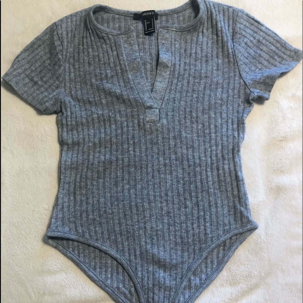 Knit Henley with snap closure.